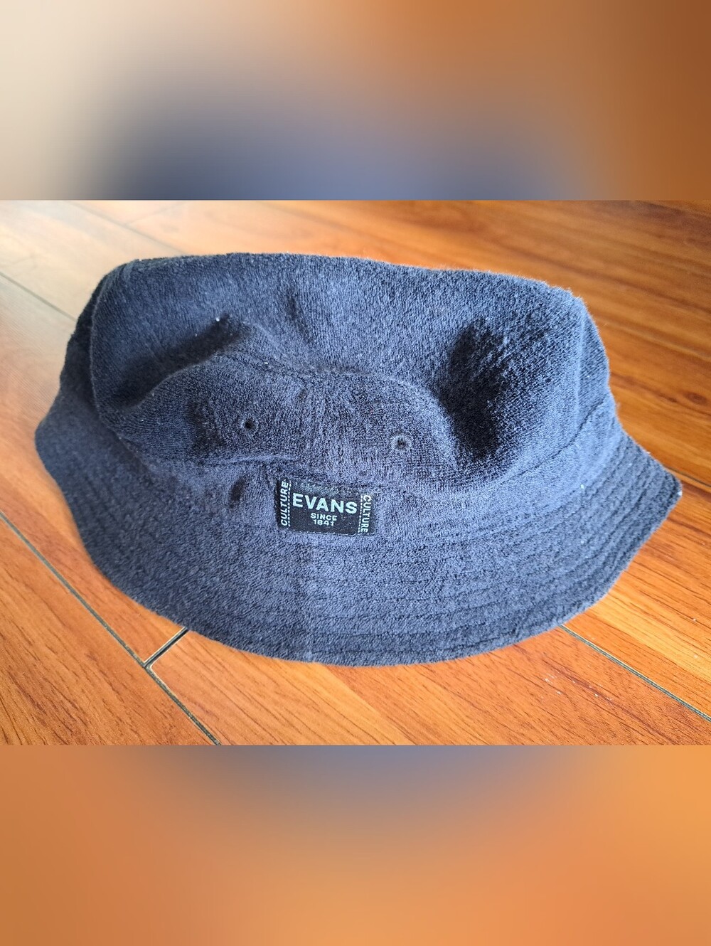 Evans Black Hat with White Label Tag